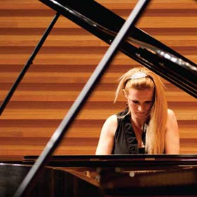 Student at a Steinway piano in the new School of Music building