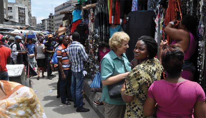 S. Elizabeth Bird shopping in a market in Lagos
