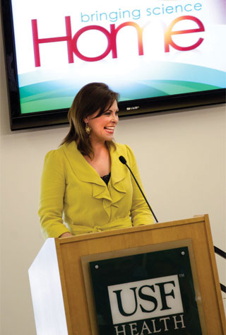 Nicole Johnson speaking at a lectern