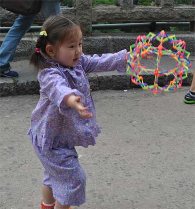 Girl playing with a ball in China