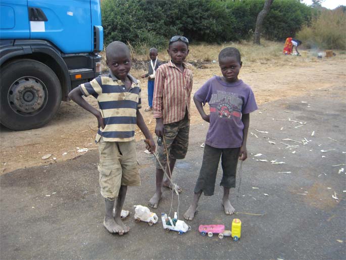Boys with toy cars in Zambia