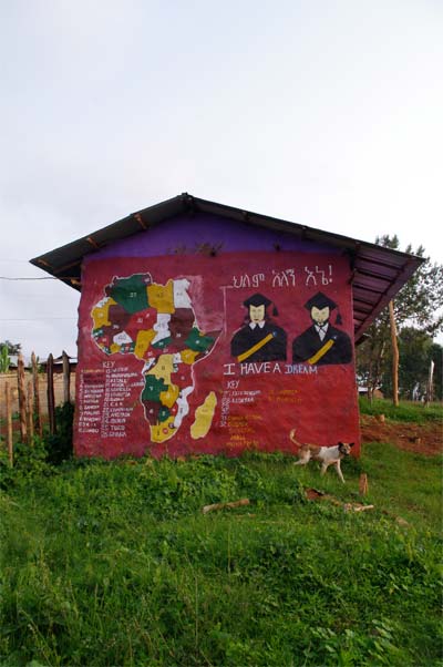 The side of a red house painted with different African countries and the words 'I have a dream'