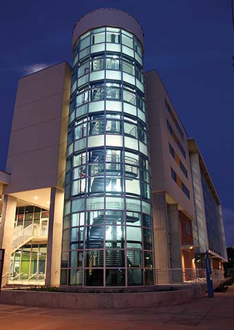 View of the University Student Center circular staircase at night.