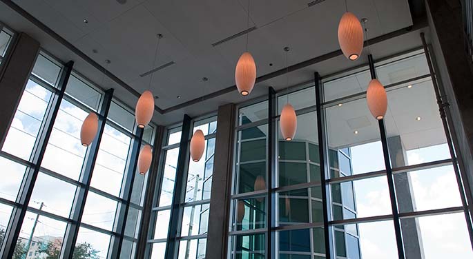 Lighting fixtures hanging from the ceiling of the University Student Center