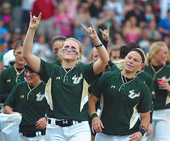 Lindsey Richardson makes the Bulls' horns with her hands.
