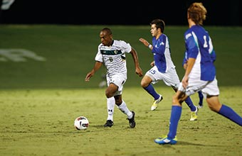 USF soccer player runs with the ball.