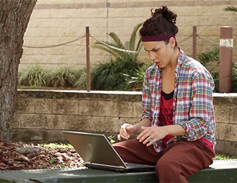 Still from the production, in which Nicole Diaz is shocked at what she reads online.