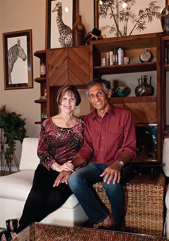 Mohan and Diana Rao sit in their home.