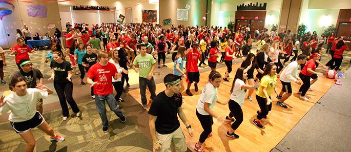 USF students dancing in a large room.